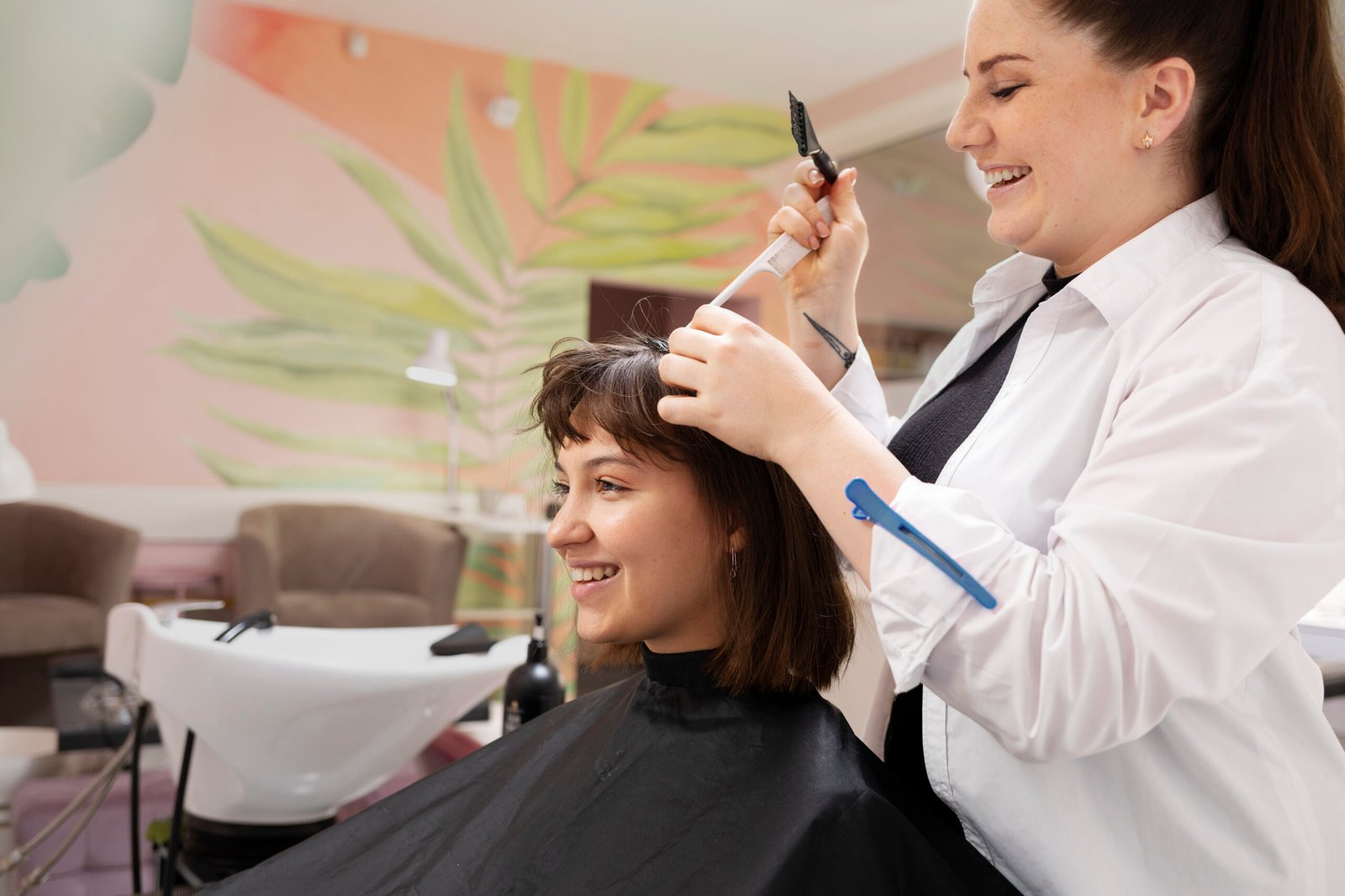woman-getting-treatment-hairdresser-shop