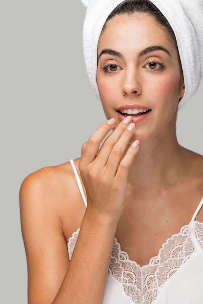 Woman applying lip balm